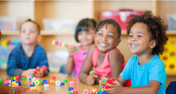 Montessori students in a Spanish bilingual preschool classroom